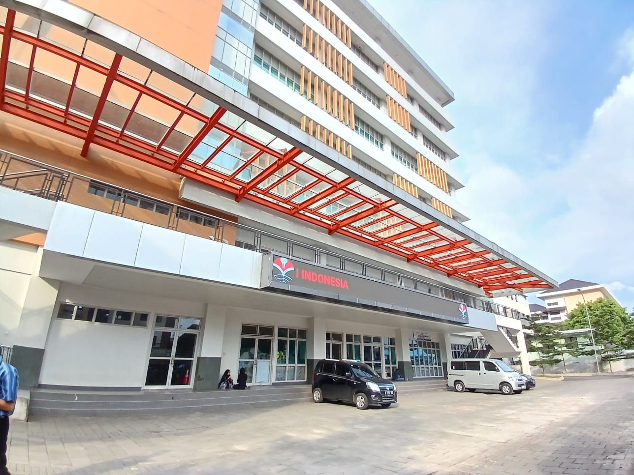 UPI building exterior with red steel canopy